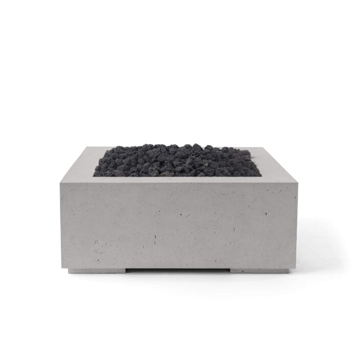 Concrete fire pit with black coals on a white background