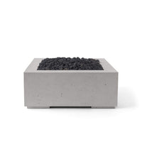 Concrete fire pit with black coals on a white background