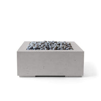 Concrete fire pit table with pebbles on a white background
