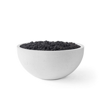 White bowl filled with black sand on a white background