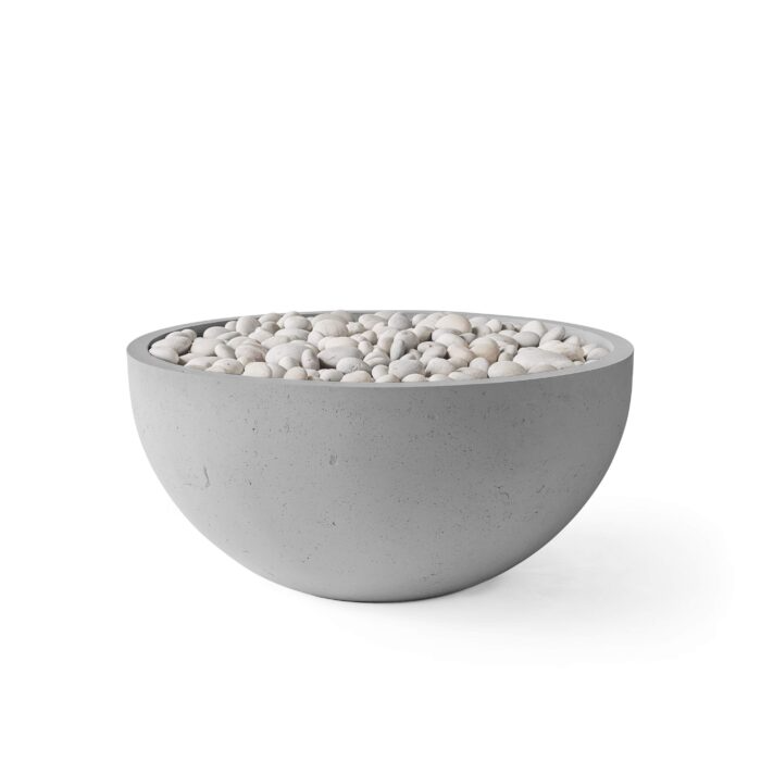 Concrete bowl filled with small stones on a white background