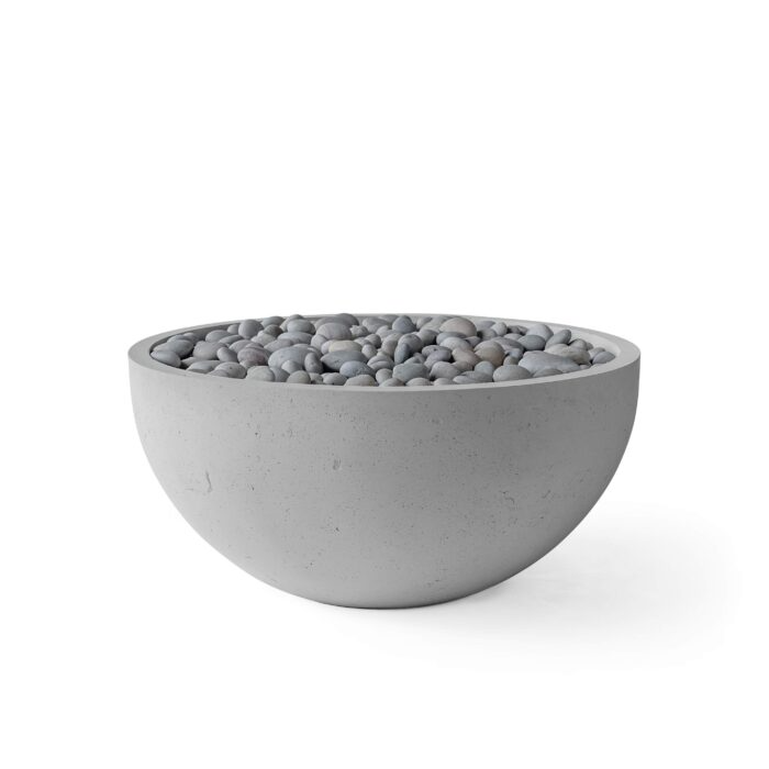 Concrete bowl filled with pebbles on a white background