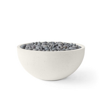 White bowl filled with gray pebbles on a white background
