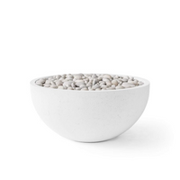White bowl filled with pebbles on a white background