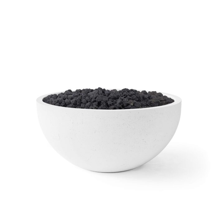 White bowl filled with black sand on a white background