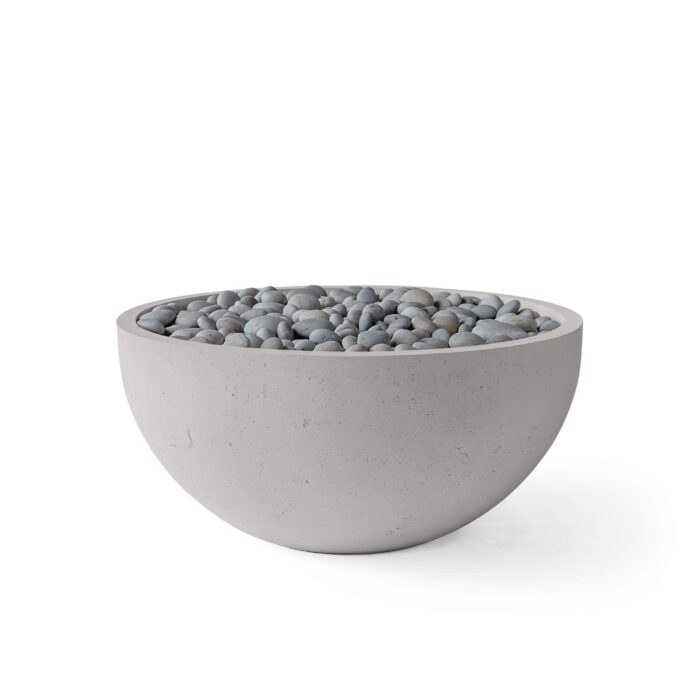 Concrete bowl filled with pebbles on a white background